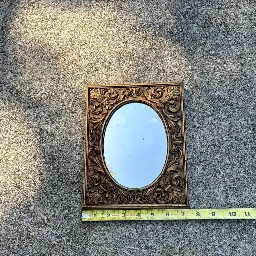 Gold Ornate Mirror with Intricate Scrollwork